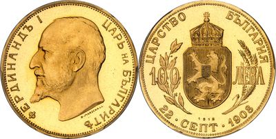 a close up of a gold coin with a crown on it