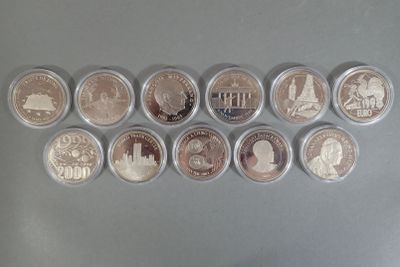 several coins are arranged in a row on a table