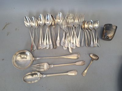 a lot of silver spoons and spoon spoons on the table