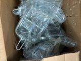 a cardboard box with a bunch of plastic items inside of it