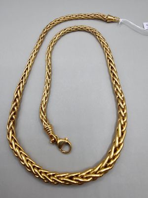 a gold chain with a clasp on a white background