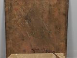 an old wooden box sitting on top of a white table