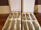 two open boxes of soap sitting on a wooden table
