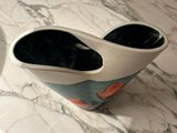 two vases that are sitting on a marble table