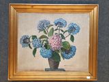 un tableau représentant des fleurs bleues et roses dans un vase