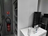 an image of a kitchen with a refrigerator and a microwave