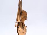 sculpture of a violin on a stand on a white background