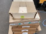 several cardboard boxes stacked on top of each other in a warehouse