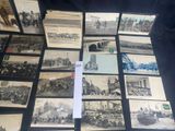 several old black and white photographs of people and vehicles on a table