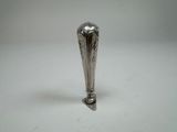 a silver spoon that is sitting on a table