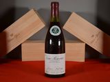 a bottle of wine that is sitting on a table