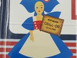 a blue and white plate with a picture of a woman holding a sign