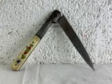 a knife that is laying on top of a wall