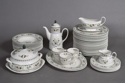 many plates, cups, and saucers that are sitting on a table