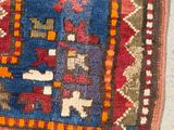 an image of a rug on the floor with a cat laying on it