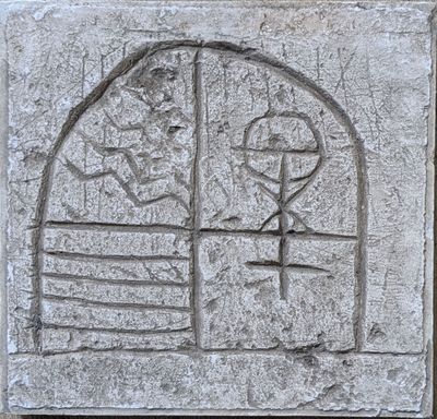 a stone plaque with a picture of a man and a woman on it