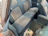 an image of a car seat with a bag in it