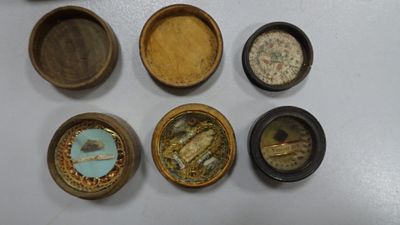 five small wooden containers that are sitting on a table