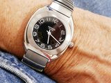 a close up of a person ' s wrist with a watch on it