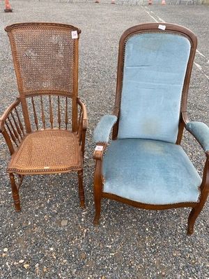two chairs sitting next to each other in a parking lot