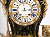 a clock that is sitting next to a mirror