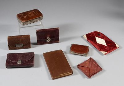 several pieces of leather are arranged on a white surface