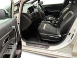 the interior of a car with the door open and the driver ' s seat up