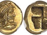 a gold coin with an image of a woman holding a cross