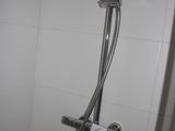 a shower head with a shower hose attached to it