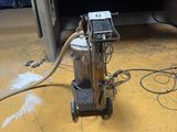 a machine that is sitting on the floor in the room