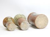 several different types of wine bottles are lined up on a white surface