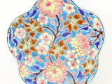 an image of a decorative plate with flowers on it
