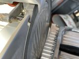 a machine that is cutting metal with a circular blade