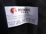 a label on the back of a jacket that says myhome