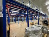 a large warehouse filled with lots of boxes and pallets