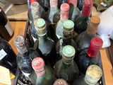 many bottles of wine in a basket on the table