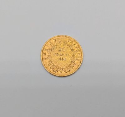 a gold coin with a crown on it