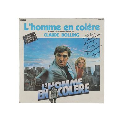 the poster for the movie l ' homme en coulee, with a man in a suit and woman