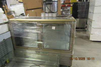 an image of a commercial refrigerator in a warehouse