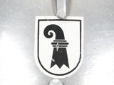 a close up of a metal object with a sticker on it