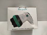 a box with a white and green blow dryer inside of it
