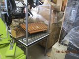 a green chair sitting in front of a metal rack