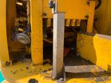 a close up of a machine that is sitting on the ground