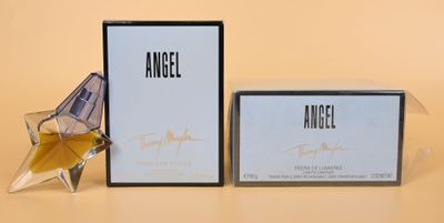 an image of an angel perfume bottle next to a box of perfume