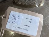a silver vase with a tag on it sitting on a table