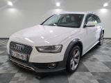 an image of a white audi suv parked in a garage