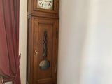 a grandfather clock in the corner of a room