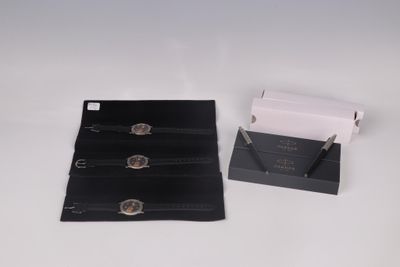 a black wallet and a white wallet on a white table