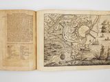 an open book with a drawing of a map on it