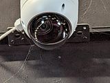 a camera attached to the side of a building
